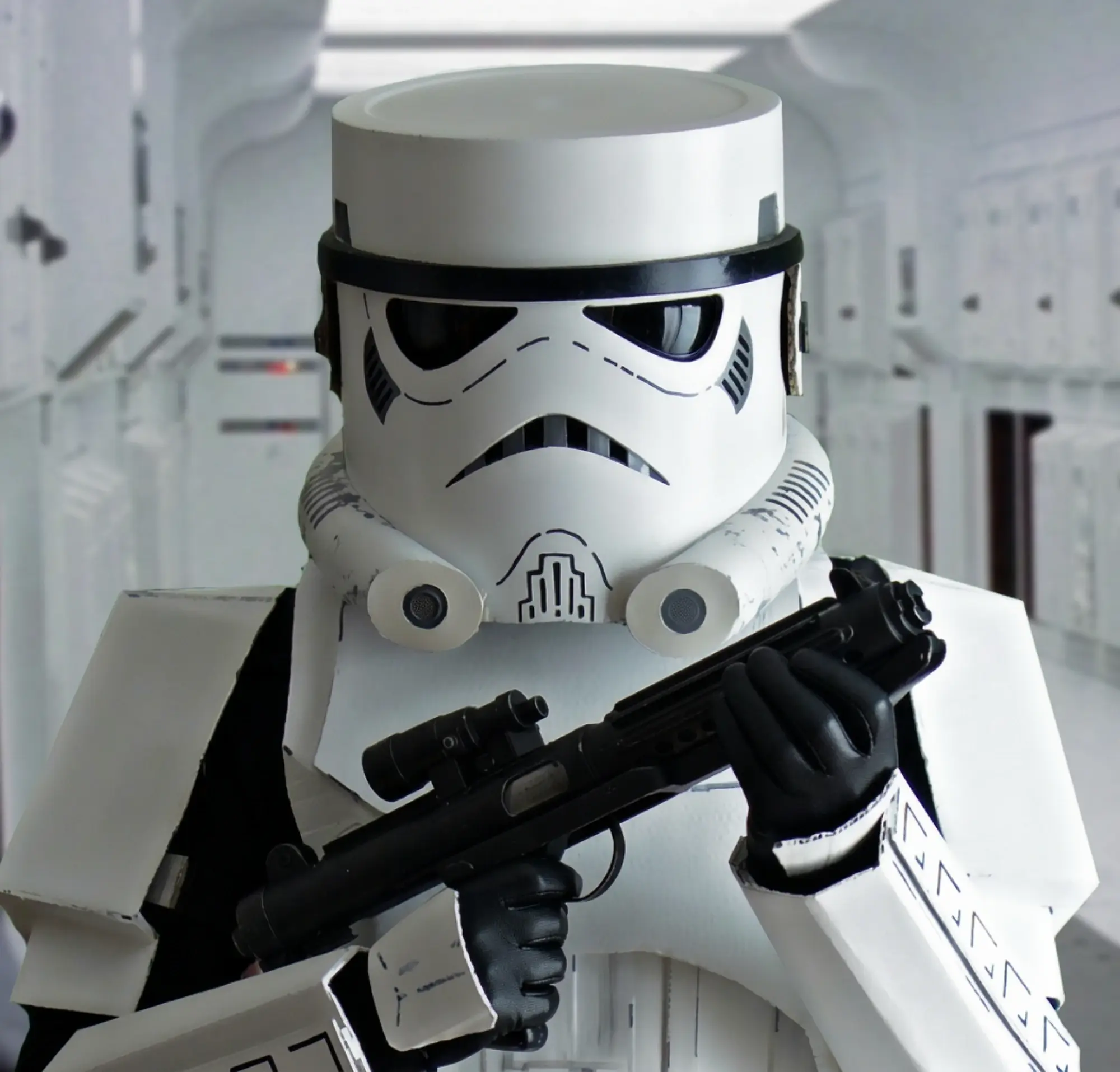 A scratch-built white armoured trooper holding a blaster